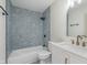 An updated bathroom with a tiled shower and white vanity at 5622 Imperial Woods Cir, Indianapolis, IN 46224