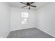 This is a bedroom featuring carpet flooring, a window, and a ceiling fan at 5622 Imperial Woods Cir, Indianapolis, IN 46224