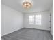 An empty bedroom with neutral carpeting and a modern ceiling fan light at 5622 Imperial Woods Cir, Indianapolis, IN 46224