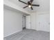A bedroom with carpet flooring featuring a closet and an entry door at 5622 Imperial Woods Cir, Indianapolis, IN 46224