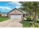 Charming brick home with a well-maintained lawn and two-car garage, perfect for Gathering living at 5622 Imperial Woods Cir, Indianapolis, IN 46224