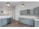 This open concept kitchen features stainless steel appliances, grey cabinets, and a wine rack at 5622 Imperial Woods Cir, Indianapolis, IN 46224