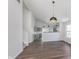 Open-concept living area with gray cabinets, hardwood floors, and abundant natural light at 5622 Imperial Woods Cir, Indianapolis, IN 46224