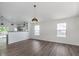 Spacious living area featuring hardwood floors, plenty of light, and an open view to the kitchen at 5622 Imperial Woods Cir, Indianapolis, IN 46224