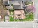 Bird's eye view showcases the home's layout, yard, and proximity to neighboring houses in a leafy suburb at 5697 Broadway St, Indianapolis, IN 46220