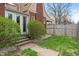 View of the backyard, greenery, and a brick exterior showcasing curb appeal at 5697 Broadway St, Indianapolis, IN 46220