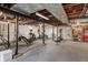 Unfinished basement featuring ample space for a home gym and storage at 5697 Broadway St, Indianapolis, IN 46220