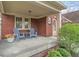 Inviting front porch with seating, perfect for relaxing and enjoying the outdoors at 5697 Broadway St, Indianapolis, IN 46220
