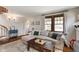 Comfortable living room showcasing hardwood floors and natural light from the windows at 5697 Broadway St, Indianapolis, IN 46220
