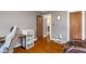 Home office with hardwood floors, a comfortable chair, and a view to another room at 5697 Broadway St, Indianapolis, IN 46220