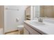Bathroom features cabinet, single sink, toilet, mirror and shower at 5839 Quail Run Dr, Indianapolis, IN 46237