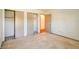 Cozy bedroom featuring neutral carpeting, closet space, and a bright, airy feel at 5839 Quail Run Dr, Indianapolis, IN 46237