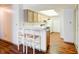 Bright kitchen with breakfast bar seating, light wood cabinets, and a full appliance package at 5839 Quail Run Dr, Indianapolis, IN 46237