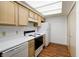 Efficient kitchen with ample storage space, updated appliances, and bright overhead lighting at 5839 Quail Run Dr, Indianapolis, IN 46237