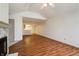 Spacious living room featuring hardwood flooring and a modern fireplace at 5839 Quail Run Dr, Indianapolis, IN 46237