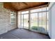 A lovely sunroom featuring sliding glass doors with view of the lawn at 5839 Quail Run Dr, Indianapolis, IN 46237