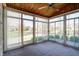 A beautiful sunroom featuring sliding windows that offers great natural lighting at 5839 Quail Run Dr, Indianapolis, IN 46237
