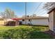 Side view of home with access to a wooden deck from the backyard at 598 Collier St, Columbus, IN 47201