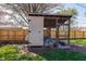 A backyard storage shed shows the access door and the open area on the side at 598 Collier St, Columbus, IN 47201