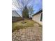 Backyard featuring brick patio, mature trees, a fire pit, and a privacy fence at 6011 Mcclellan Ct, Indianapolis, IN 46254