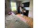Comfortable bedroom featuring hardwood floors, ceiling fan, and dresser at 6011 Mcclellan Ct, Indianapolis, IN 46254
