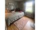 Cozy bedroom featuring a plush rug, window and warm natural light at 6011 Mcclellan Ct, Indianapolis, IN 46254