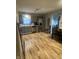 Updated kitchen with stainless steel appliances, gray cabinets, and a breakfast area at 6011 Mcclellan Ct, Indianapolis, IN 46254