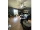 Inviting living room featuring a ceiling fan, stylish decor, and plenty of natural light at 6011 Mcclellan Ct, Indianapolis, IN 46254