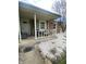 Cozy covered porch with comfortable seating offers a welcoming entrance to the home at 6011 Mcclellan Ct, Indianapolis, IN 46254