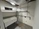 Basement utility sink with shelving, providing a functional area for laundry or projects at 616 Elbow Bend Blvd, Greenwood, IN 46142