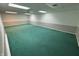 Spacious basement with green carpet, offering plenty of room for activities and storage at 616 Elbow Bend Blvd, Greenwood, IN 46142