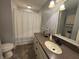 Well-lit bathroom featuring a single sink vanity and shower with a curtain at 616 Elbow Bend Blvd, Greenwood, IN 46142
