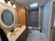 Bathroom featuring a shower, vanity, skylight, and tiled floor at 616 Elbow Bend Blvd, Greenwood, IN 46142