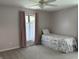 Bright bedroom with a single bed and pink curtains, offering a simple and clean aesthetic at 616 Elbow Bend Blvd, Greenwood, IN 46142