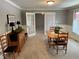 Light-filled dining room with neutral walls, white trim, and wood furniture creates a cozy atmosphere at 616 Elbow Bend Blvd, Greenwood, IN 46142