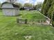 Fenced vegetable garden next to a storage shed in the backyard at 616 Elbow Bend Blvd, Greenwood, IN 46142