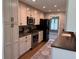 Well-equipped kitchen features stainless steel appliances, custom cabinets, and modern finishes at 616 Elbow Bend Blvd, Greenwood, IN 46142