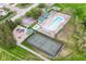 An aerial view of community amenities, including a pool, tennis court, playground, and green spaces, all meticulously maintained at 6164 Parrington Dr, Indianapolis, IN 46236