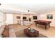 Finished basement featuring a cozy lounge area, a pool table, and ample space for recreation at 6164 Parrington Dr, Indianapolis, IN 46236