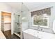 Beautiful bathroom featuring a glass enclosed shower, and a luxurious soaking tub at 6164 Parrington Dr, Indianapolis, IN 46236