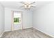 Bedroom featuring carpet, a ceiling fan, and a window with a pleasant outside view at 6164 Parrington Dr, Indianapolis, IN 46236