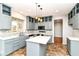 Modern kitchen with gray cabinets, white countertops, and stylish backsplash at 6164 Parrington Dr, Indianapolis, IN 46236