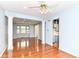 Spacious living room with hardwood floors and views to the kitchen and dining area at 6164 Parrington Dr, Indianapolis, IN 46236