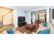 Open-concept living room showcasing hardwood floors, decorative columns, and a view into dining area at 6164 Parrington Dr, Indianapolis, IN 46236