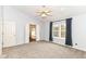 Spacious main bedroom with neutral tones, plush carpet, and natural light from the window at 6164 Parrington Dr, Indianapolis, IN 46236