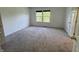 Bedroom with two bright windows, carpet flooring and neutral walls offers a comfortable space at 621 Jack Pine Ct, Indianapolis, IN 46224