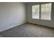 Bright bedroom with two windows, neutral walls, and plush carpeting at 621 Jack Pine Ct, Indianapolis, IN 46224