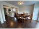 Bright dining area showcases hardwood floors and flows into the modern kitchen with an island and stainless appliances at 621 Jack Pine Ct, Indianapolis, IN 46224