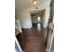 Inviting entryway featuring hardwood floors, staircase, and views to a living space at 621 Jack Pine Ct, Indianapolis, IN 46224