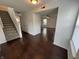 Spacious entryway with hardwood floors, staircase, and open view to the living area at 621 Jack Pine Ct, Indianapolis, IN 46224